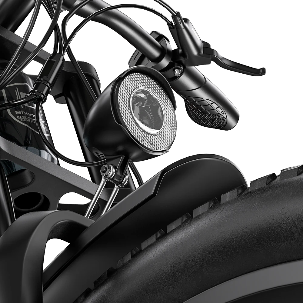 Close-up of the front headlight mounted above the Shengmilo S700 PRO front fender.