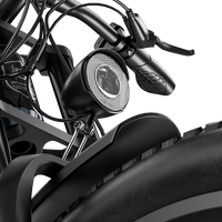 Close-up of the front headlight mounted above the Shengmilo S700 PRO front fender.